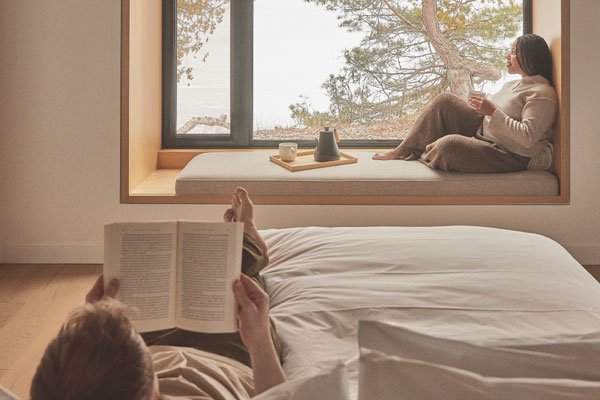 Image of a couple reading in their room