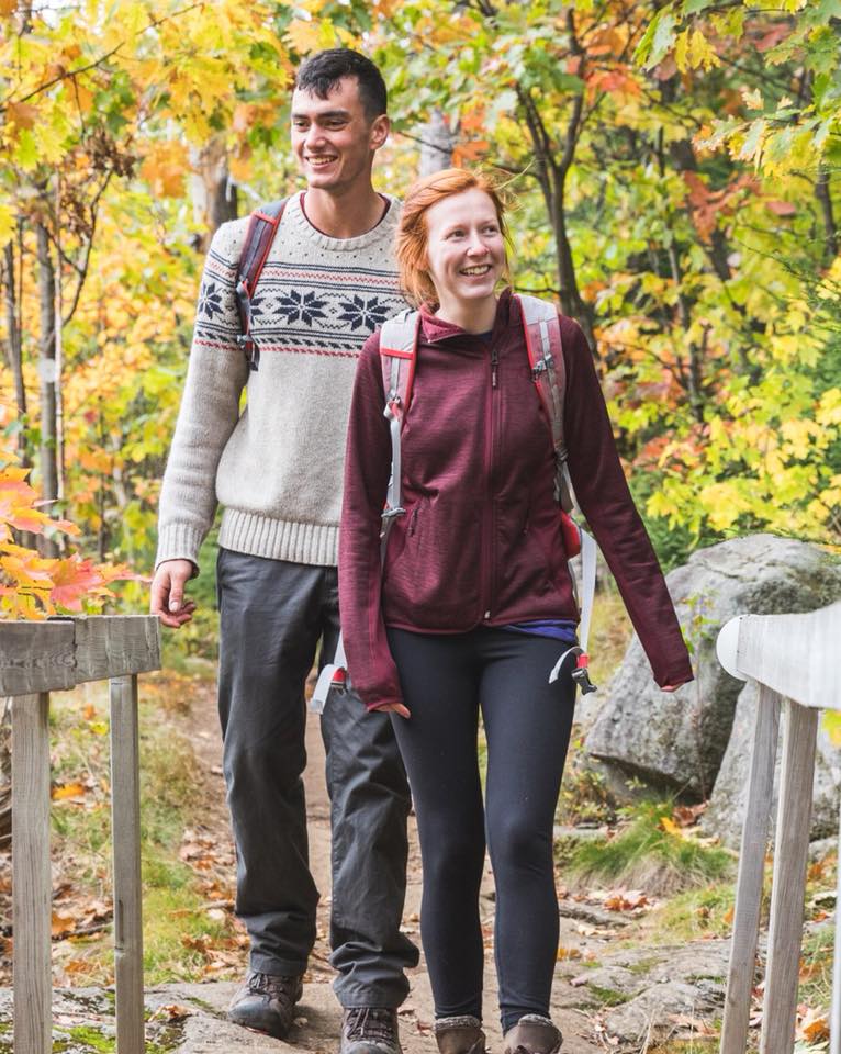 Image of a couple hiking in the woods