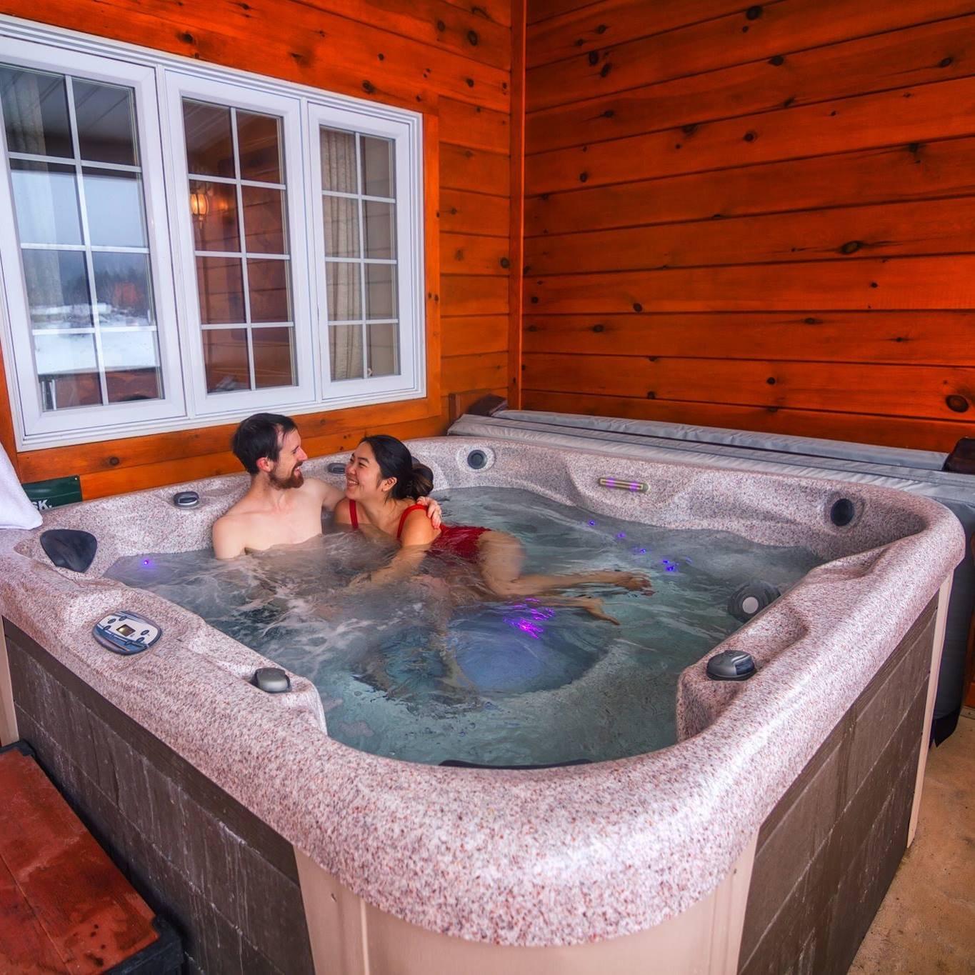 Couples enjoying a outdoor hot tub