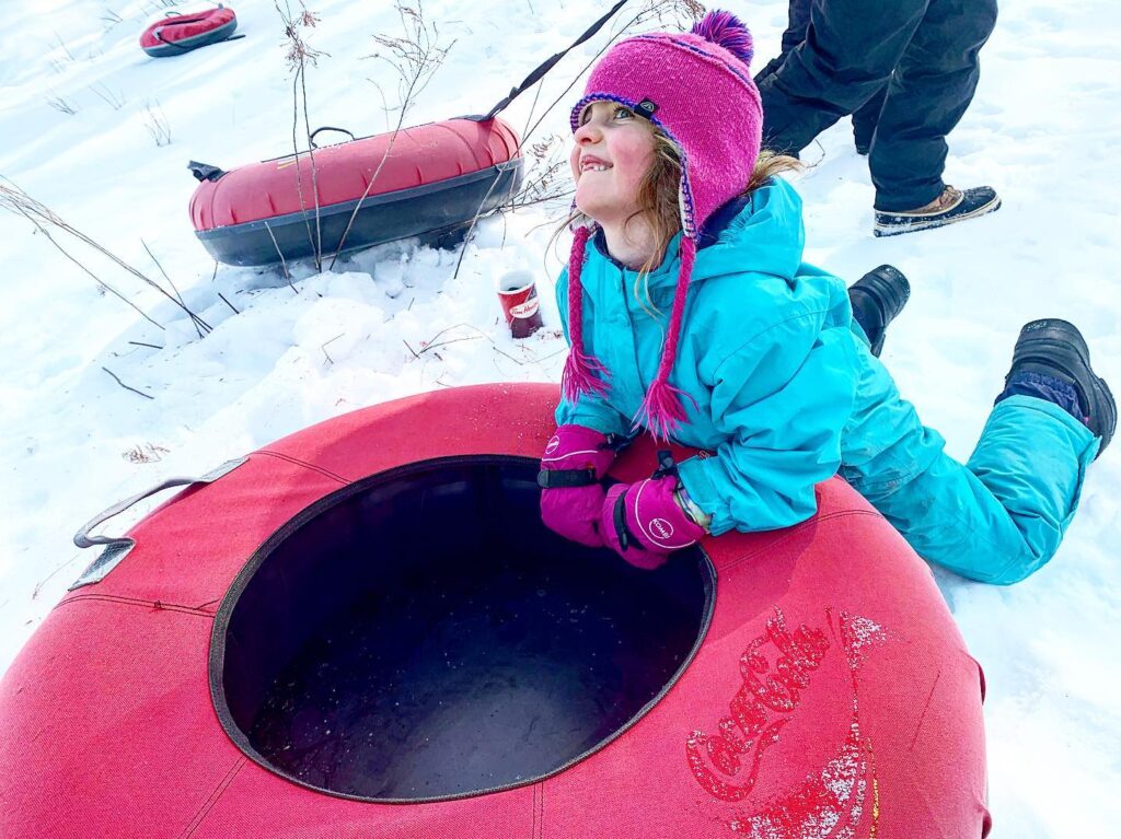 Image of a girl tubing!