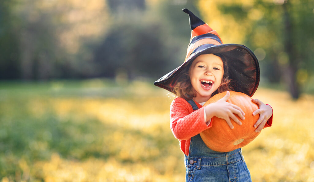 Image of a girl holding a pumpkin at Fern Resort - Resorts of Ontario