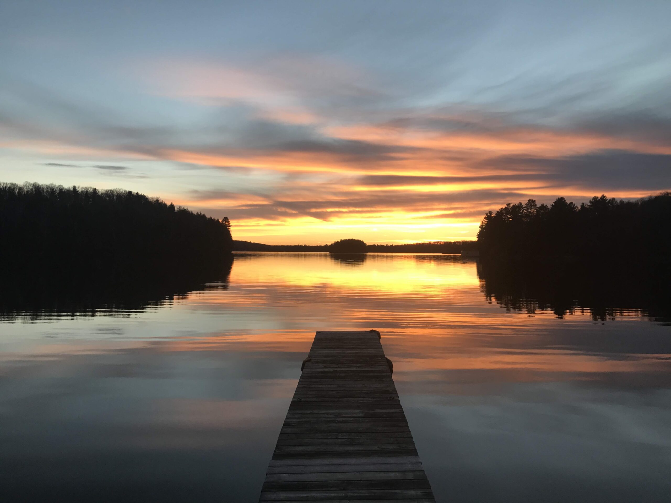 Image of a sunset from a Canoe at Bondi Resort - Resorts of Ontario