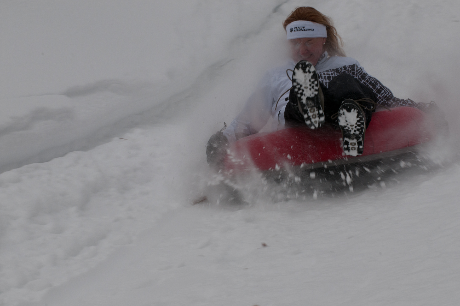 Image of a lady snow tubing at Blue Water Acres Resort - Resorts of Ontario